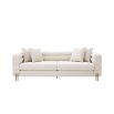 A luxurious sofa by Eichholtz with Art Deco undertones and glamorous golden feet