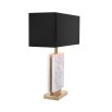 white marble lamp with black lampshade and brass accents 