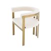 boucle upholstered chair with brushed brass frame