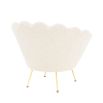 art deco-inspired boucle trapezium armchair with brass legs