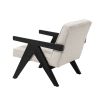 A luxurious boucle armchair with black legs 