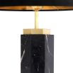 black marble table lamp with antique brass accents and a black lampshade