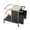 A luxurious dark grey and brushed brass drinks trolley