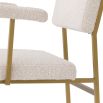 Modern cream boucle upholstered chair with brushed brass finish by Eichholtz