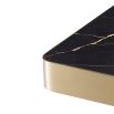 Luxurious Eichholtz brushed brass side table with a chunky solid frame and black marble effect tabletop