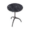 A chic black marble side table with a hammered black gunmetal base