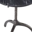 A chic black marble side table with a hammered black gunmetal base