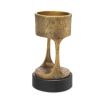 A vintage style brass candle holder with a granite base