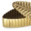 A luxurious polished brass leaf-shaped decorative box