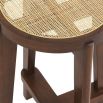 A stylish Scandinavian-inspired rattan counter stool with a brown finish