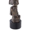 Complete with a black shade, this table lamp boasts an artistic, rocky base that sits on a smooth black base.