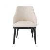 A luxurious dining chair by Eichholtz with a Pausa Natural upholstery and sleek black tapered legs 