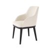 A luxurious dining chair by Eichholtz with a Pausa Natural upholstery and sleek black tapered legs 