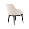 A luxurious dining chair by Eichholtz with a Pausa Natural upholstery and sleek black tapered legs 