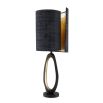 A modern luxury table lamp with black and brass accents by Eichholtz