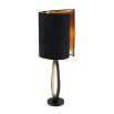 A modern luxury table lamp with black and brass accents by Eichholtz