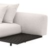 A functional two seater sofa by Eichholtz with a modern off-white upholstery, a bronze base and an integrated side table