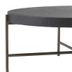 A solid stainless steel and wood coffee table in a gunmetal and bronze finish