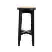 A chic black Scandinavian-inspired bar stool with rattan cane webbing