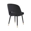 Set of 2 black velvet dining chairs with faux leather piping and golden detailing