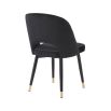 Set of 2 black velvet dining chairs with faux leather piping and golden detailing