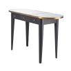 A luxurious, grey charcoal dressing table with brass details and a mirrored surface