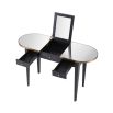 A luxurious, grey charcoal dressing table with brass details and a mirrored surface