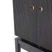 A luxurious mid-century modern bar cabinet with a ribbed design in charcoal grey