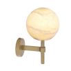 A luxurious antique brass wall lamp with an elegant, alabaster shade