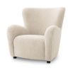 Luxurious fluffy cream-coloured mid-century inspired armchair with black feet