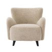 A luxurious fluffy cream-coloured mid-century inspired armchair