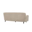 A luxurious mid-century modern inspired Canberra sand upholstered sofa with black legs