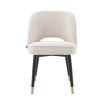 Luxurious Eichholtz dining chairs in a boucle cream fabric with black legs