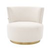 A beautiful armchair with boucle upholstery and a brushed brass swivel base