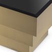 Contemporary luxe brass coffee table with black glass surface by Eichholtz