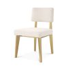 A luxurious modern brushed brass and boucle dining chair 