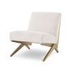 Modern Eichholtz boucle cream chair with brushed brass accents