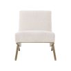 Modern Eichholtz boucle cream chair with brushed brass accents