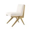 A luxurious boucle and brushed brass dining chair