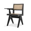 A classic Jeanerette inspired black rattan chair with a desk