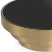 Eichholtz circular brushed brass coffee table with black glass top