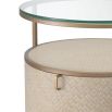 A chic washed oak bedside table with a brushed brass structure and clear glass tabletop