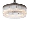 Eichholtz luxurious round chandelier with multiple clear glass rod tiers held by a bronzed iron frame