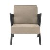 A chic, tan-toned leather armchair with contrasting dark brown x-shaped legs