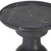 A stately black marble table with white veining 