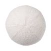 A luxurious large round boucle cushion 