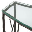 A stylish, nature-inspired console table by Eichholtz with a bronze branch-like frame and semi-circular clear glass top