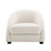 Luxurious boucle cream armchair with sloped arms by Eichholtz