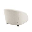 Luxurious boucle cream armchair with sloped arms by Eichholtz