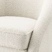 Luxurious boucle cream armchair with sloped arms by Eichholtz